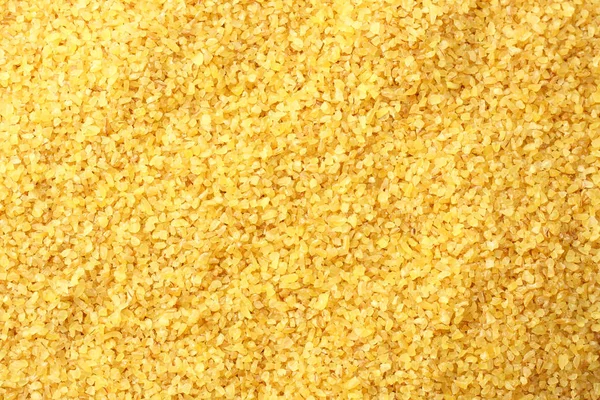 Bulgurweizen Hintergrund. Bulgur Weizen Textur. Ansicht von oben — Stockfoto