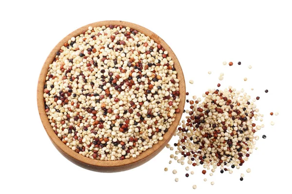 Quinoa in a wooden bowl isolated on white background. quinoa seed. top view — Stok fotoğraf