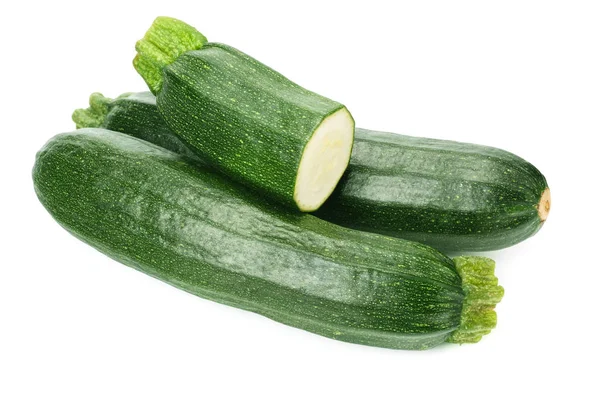 Zucchine fresche verdi con fette isolate su fondo bianco . — Foto Stock