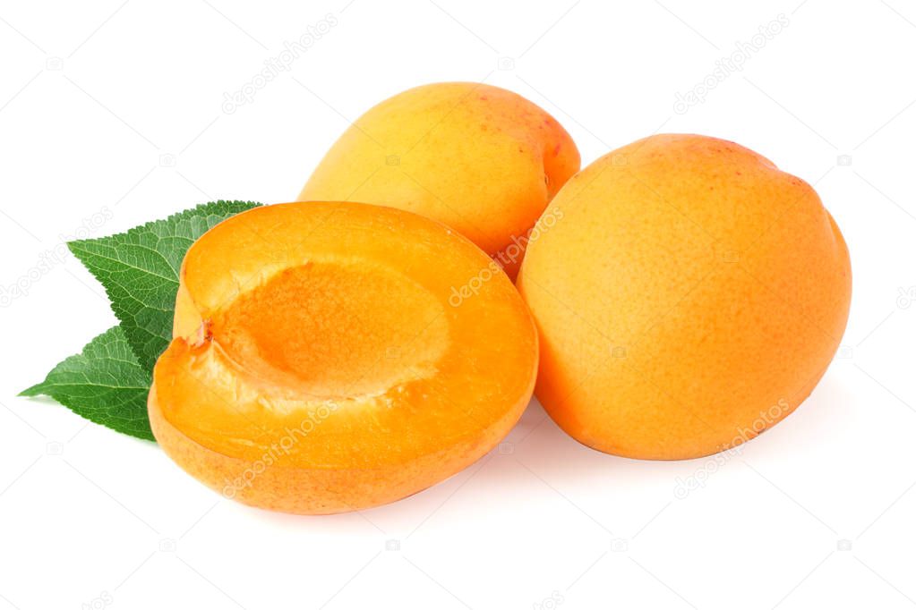 apricot fruits with slices and green leaf isolated on white background.  