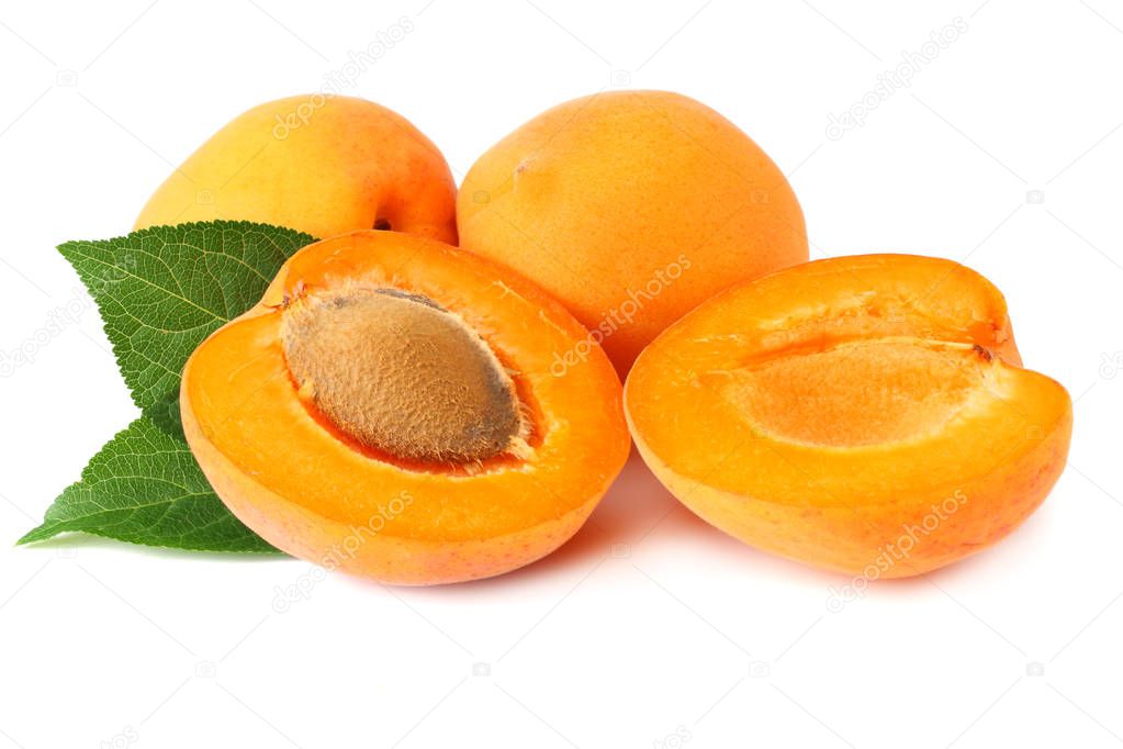 apricot fruits with slices and green leaf isolated on white background.  