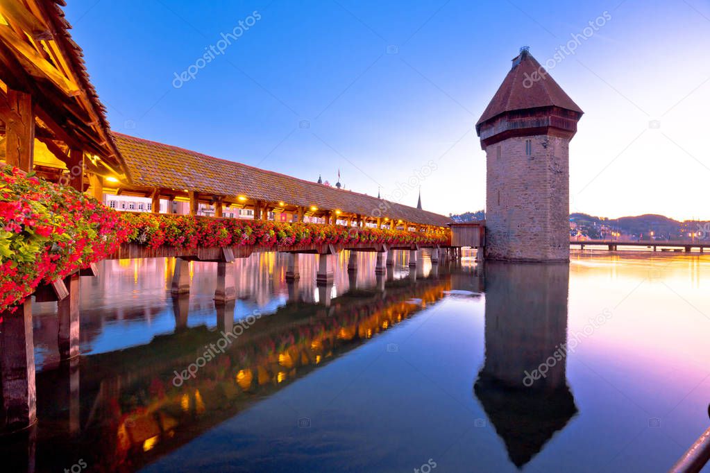 Luzern wooden Chapel Bridge and tower dawn view, town in central Switzerland