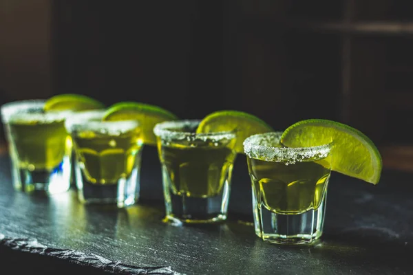 Mexican Gold Tequila Shot Lime Salt Black Stone Table Surface — Stock Photo, Image