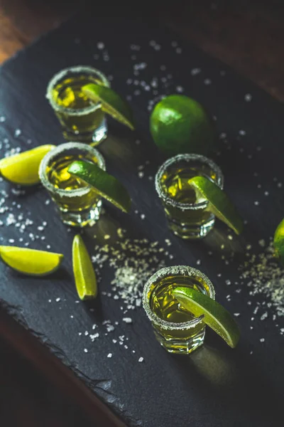 Mexican Gold Tequila Shot Lime Salt Black Stone Table Surface — Stock Photo, Image