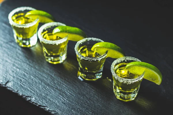 Mexican Gold Tequila Shot Lime Salt Black Stone Table Surface — Stock Photo, Image