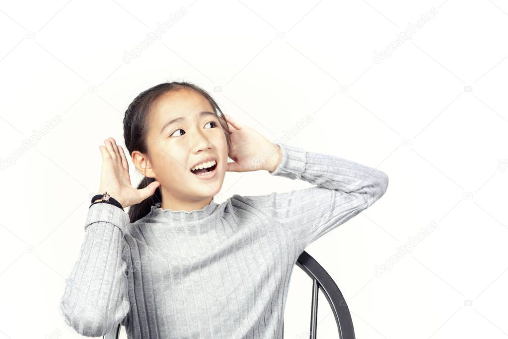 asian teenager raise hand up to hearing isolated white background