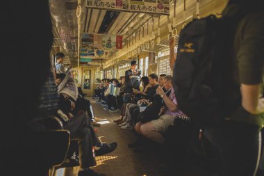 osaka japan - november5,2018 : unidentified japanese people boarding on hunkyu mino line local trains to mino station osaka japan clipart