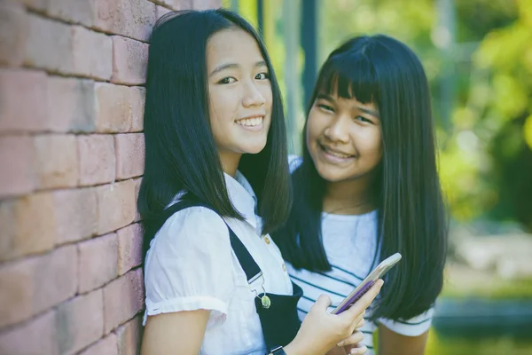 Two Asian Teenager Toothy Smiling Face Happiness Emotion Holdhing Smartphone — Stock Photo, Image