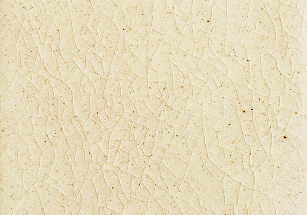 Beyaz krem kaplı fayans üzerindeki çatlakların arka plan ve dokusunu kapat