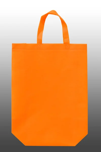 orange color of cloth shopping bag isolated on black and white gradient background