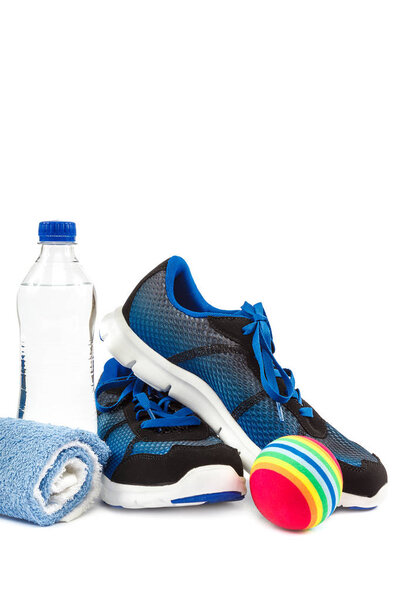Stylish sneakers, towel and water bottle isolated on white background.