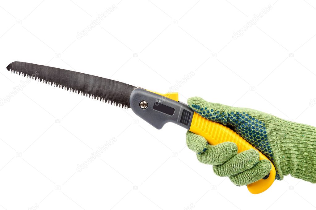 Folding garden saw in hand with glove isolated on white background.