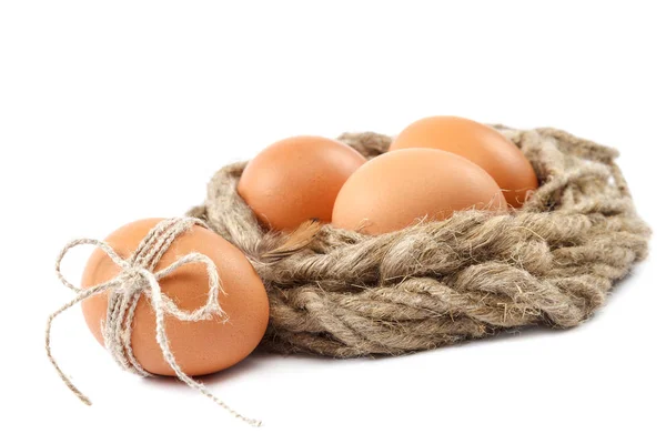 Huevos de pollo en un lienzo sobre fondo blanco — Foto de Stock