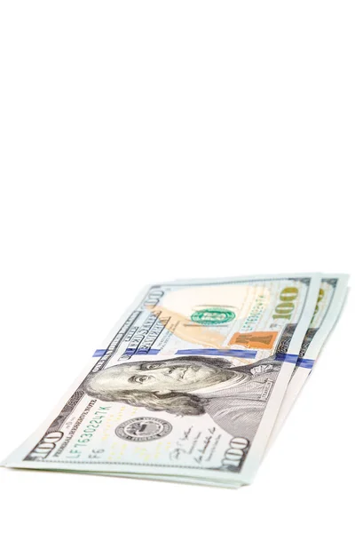 Dinheiro dólares EUA em um fundo branco — Fotografia de Stock