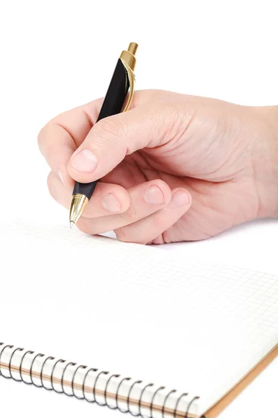 Pen in hand and notebook on white background