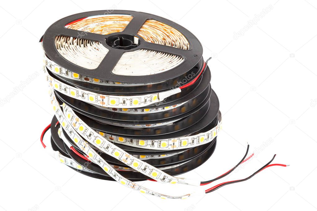 Reels with ribbons of LED lamps on white background.