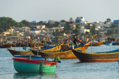 MUI NE, VIETNAM - FEBRUARY 01, 2016 : Fishing village and colorful fishing boats near Mui Ne at a sunny day