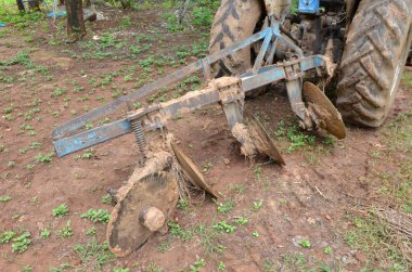 Vintage farming equipment on tractor 