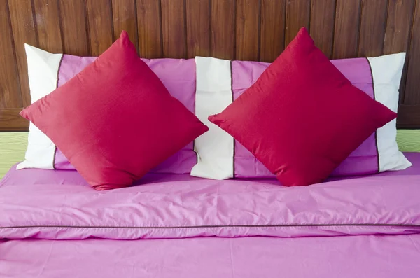 Bed with pink pillows