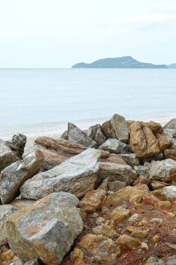 Untouched tropical beach with stones