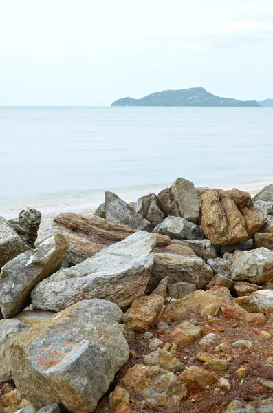 Untouched tropical beach with stones