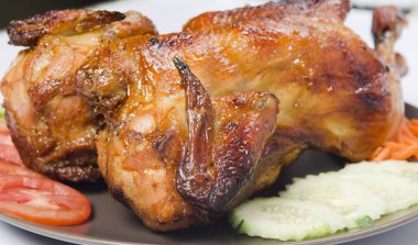 whole grilled chicken served with vegetable