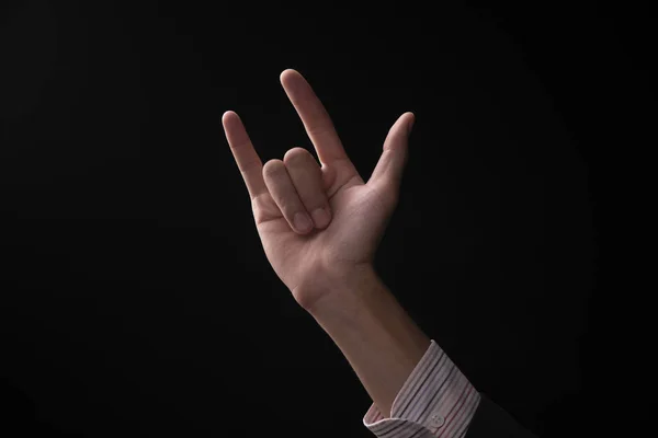 黒い背景にビジネスマンの感情の手 — ストック写真