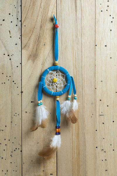 dreamcatcher on wood background