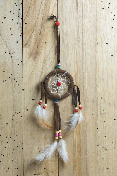dreamcatcher on wood background