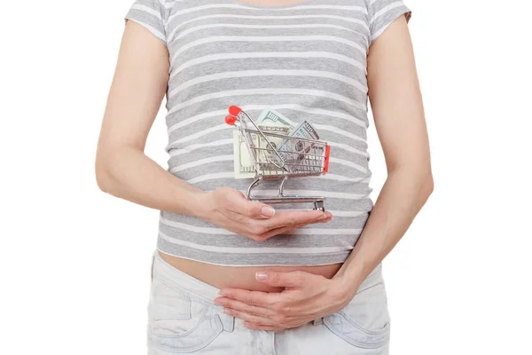 Беременная женщина с долларами и копилкой в руках — стоковое фото