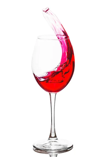 Wine glass with rose wine inside, wine wave, light background, studio shoot