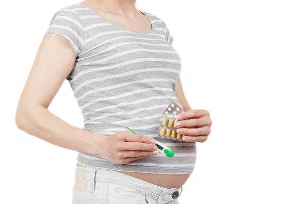 分離された手で異なる薬を妊娠中の女性 — ストック写真
