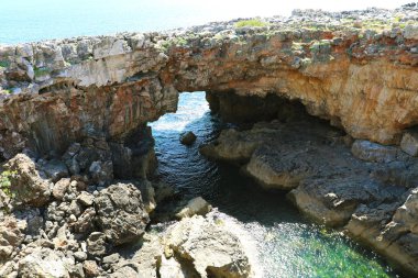 Hell's Mouth (Boca di Inferno) is a chasm located in the seaside cliffs close to the Portuguese city of Cascais, in the District of Lisbon, Portugal clipart