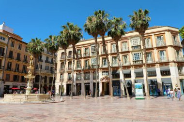 MALAGA, SPAIN - JUNE 12, 2018: Plaza de la Constitucion square e Fuente de Genova fountain, Malaga, Spain