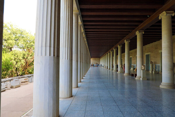 ATHENS, GREECE - JULY 18, 2018: architecture columns and walkway outside of the Museum of Ancient Agora in Stoa of Attalos, Athens, Greece