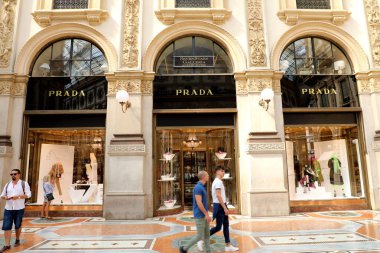 MILAN, ITALY - SEPTEMBER 10, 2018: Facade of Prada store inside Galleria Vittorio Emanuele II the world's oldest shopping mall, Milan, Italy clipart
