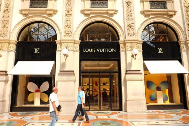 MILAN, ITALY - SEPTEMBER 10, 2018: Facade of Louis Vuitton store inside Galleria Vittorio Emanuele II the world's oldest shopping mall, Milan, Italy clipart