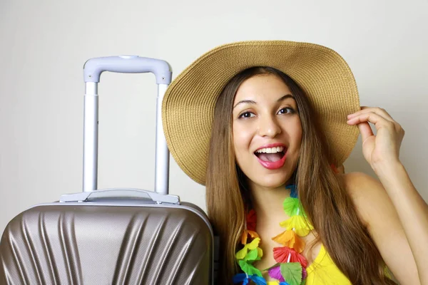 Laughing girl ready for travel. Picture of traveler woman ready for tropical places.