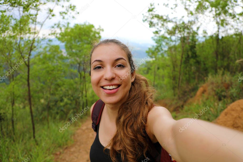 Young hiker woman take self portrait in brazilian forest
