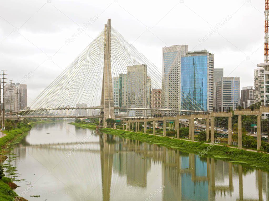 Sao Paulo city landmark Estaiada Bridge reflex in Pinheiros river, Sao Paulo, Brazil