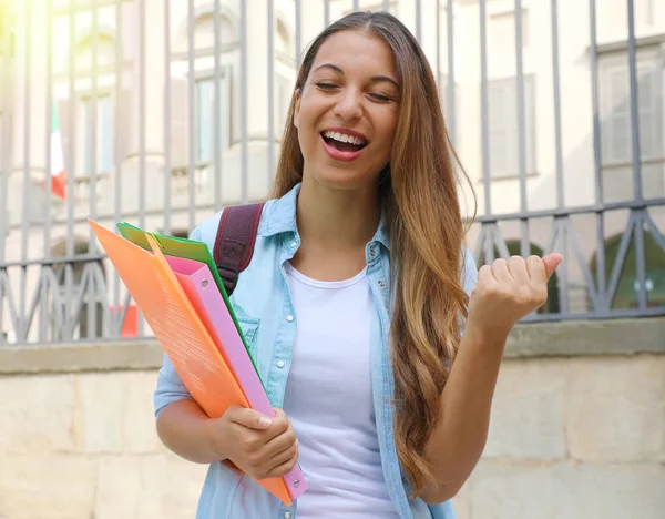 Excited student girl raising fist up outdoors. — Stock Photo, Image