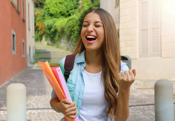 Excited female student celebrating the end of the school year. — Stock Photo, Image