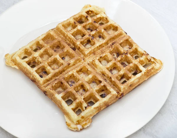 Homemade square belgian waffle on white plate — Stock Photo, Image