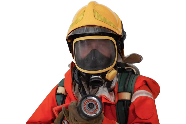 Feuerwehrmann mit Maske steht allein im Schutzanzug Stockbild