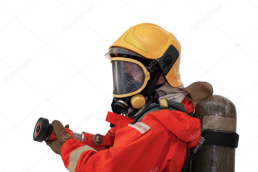 Firefighter with mask wearing safety suite and holding extinguis