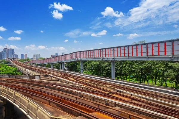 Trains traveling on elevated rails of System Thailand, Bangkok mass rapid train travels on the track.