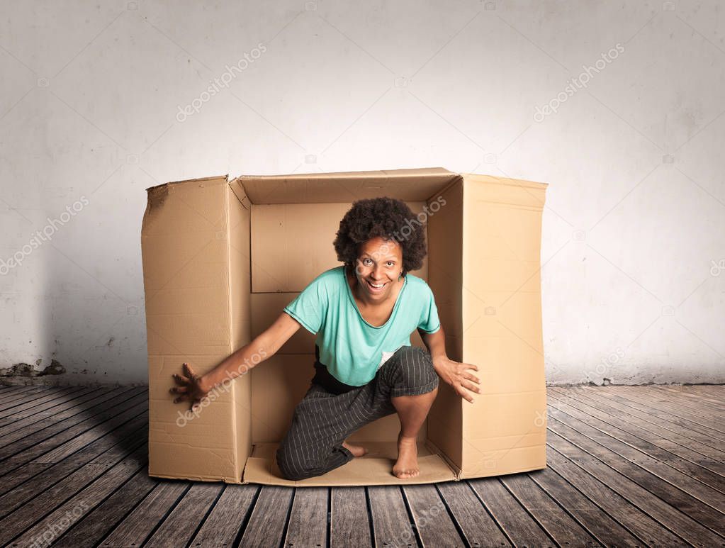 happy black woman inside a Box on a room