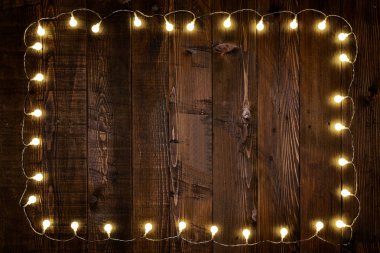 light bulbs on wooden background clipart