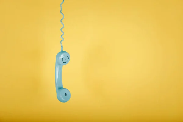 Blue Vintage Telephone Hanging Yellow Background — Stock Photo, Image