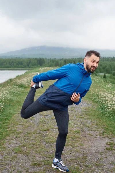 Man exercising outdoor on gloomy day